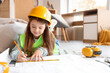 © Pixel-Shot - Cute little builder drawing plan at home