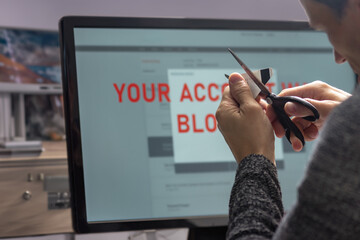 Poster - Man cutting his credit card because of system warning alert about compromised information