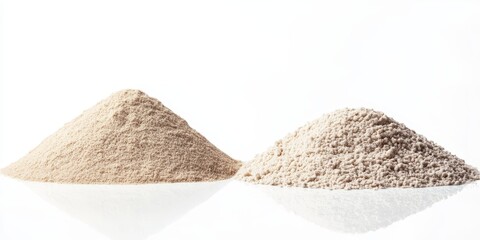 Poster - Two distinct piles of sand isolated on a white background highlight the unique texture and color variations of sand, showcasing the versatility and natural beauty of sand in artistic compositions.