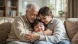 © Natalia - Family embracing on the couch, enjoying quality time together and sharing affection