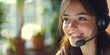 © Rufat - Cheerful and beautiful young phone operator providing support while wearing a headset, showcasing the friendly and professional demeanor of a dedicated support team member.