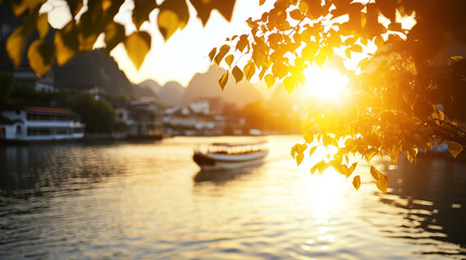 Wall Mural - golden sunset over river with boat in serene landscape near mountainous region