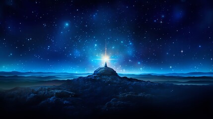 Wall Mural - Bright light atop a mountain at night.