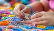 © Ilja - Colorful Friendship Bracelets Child s Hands Creating DIY Jewelry, Weaving with Threads and Beads