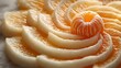 © Natcharat - Perfectly peeled orange arranged with spiral rind on a smooth white background