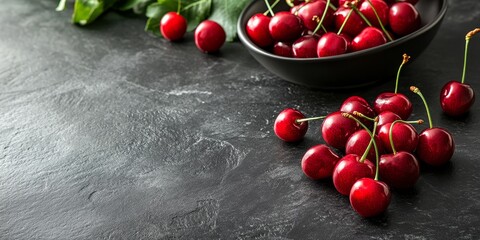 Poster - Cherries displayed on a black stone table create a vibrant kitchen scene. These fresh cherries add a refreshing touch, enhancing the overall aesthetic of the kitchen environment.
