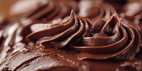 Poster - A detailed view of a sweet treat featuring a rich chocolate icing on top. This dessert showcases its delicious chocolate frosting prominently.