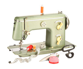 Sewing machine, measuring tape, scissors, pincushion and spools of threads isolated on white