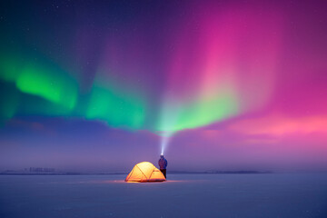 Wall Mural - Tourist shines a flashlight in incredible starry sky with Aurora borealis. Gorgeous night landscape with polar lights and yellow tent. Northern lights in winter field