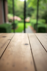 Poster - The top of a wooden table blends into the blurry view behind it, with a garden visible in the background._00003_