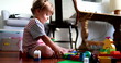 © Marco - Little baby toddler playing with building blocks