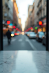 Poster - A marble tabletop provides a sharp contrast to the blurred urban landscape visible through the selective focus of a camera lens._00001_