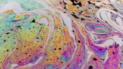 Wall Mural - Closeup video of a soap bubble showing thin film interference concept and the resulting different colors of light with each moving and swirling shapes. Perfect for illustrating concepts of physics.