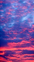 Poster - Abstract pink, red and blue sky background with natural patterns of clouds illuminated during sunrise. Topics: weather, climate, air space, atmosphere, meteorology, season, abstraction, nature