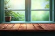 © MUdaylah - Empty wood table top on blur window sill and kitchen shelf background