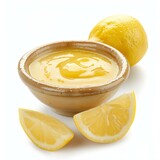 Lemon curd in a ceramic bowl, served with fresh lemons and lemon slices, creating a tangy and refreshing treat