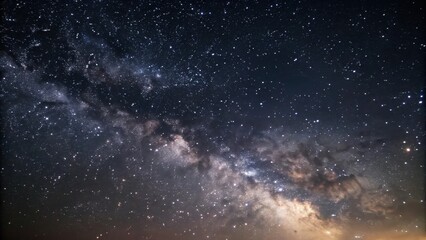 Wall Mural - a breathtaking view of the milky way stretching across the night sky, shimmering with countless star
