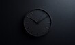© EFA - A minimalist black wall clock displaying time in a sleek, modern design.