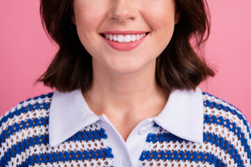 Wall Mural - Charming young woman with brunette bob hair in stylish knit top against pink background expressing happiness