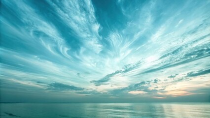 Aufkleber - A mesmerizing seascape with a vibrant turquoise sky adorned with delicate, swirling clouds, reflecting a tranquil, ethereal atmosphere.
