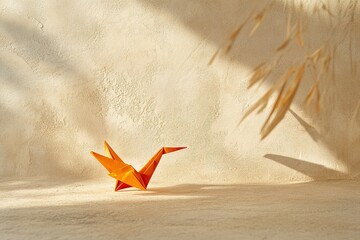 Poster - vibrant origami crane placed on textured beige surface under lighting
