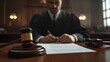 © afif - Judge signing legal document in courtroom.