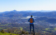 © poliki - Hiker with Irun in the background. Way of St. James or northern route on Mount Jaizkibel, Euskadi.