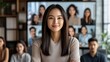© EFA - A woman smiles in front of a virtual meeting display with participants.