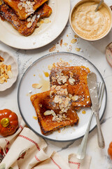 Wall Mural - Pumpkin French Toast with Maple Syrup, Almonds and Powdered Sugar