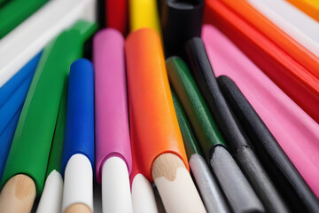 Colorful pencils forming a vibrant rainbow pattern