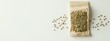 © Valentina - Hemp seeds on a white background. Selective focus