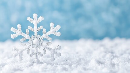 Wall Mural - Single snowflake on snow, blue background.