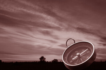Wall Mural - classic navigation compass on natural background