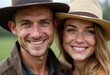 © Vibudhaart - A happy young couple smiles warmly at the camera, wearing hats outdoors.