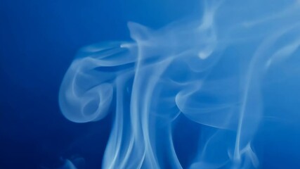 Wall Mural - ethereal smoke wisps gliding through a deep blue atmosphere with dreamlike elegance and shimmering h