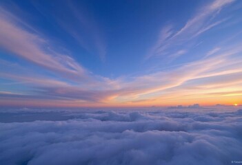 a view of a sunset over a cloud filled sky