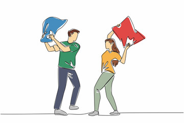 Poster - continuous one line drawing young couple standing hold pillows. joking to express excitement. releas