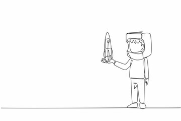 Poster - Single continuous line drawing boy holding cardboard rocket wearing cardboard helmet. Resembling spaceman. Dreams that must come true. Big dreams. Cosmonautics Day. One line design vector illustration