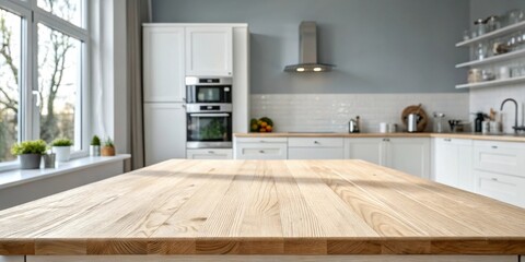 Fototapete - A close-up of a wooden kitchen table top with a blurry background of a modern kitchen