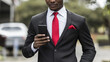 © Benjamin - A business man with a black suit and a red tie over a white shirt .