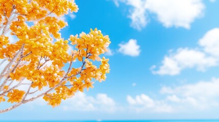 Canvas Print - Golden tree branches against a vibrant blue sky and calm ocean.