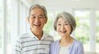 © Yuudaishin - Happy Elderly Japanese Couple Smiling in a Bright and Peaceful Home Setting