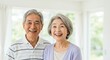 © Yuudaishin - Happy Elderly Japanese Couple Smiling in a Bright and Peaceful Home Setting