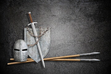 Wall Mural - knight sword shield helmet and lance on abstract black background