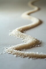 Poster - clean spiral of sugar grains cascading onto smooth matte surface under soft natural light