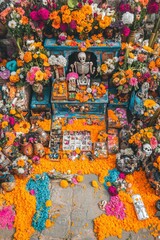 Wall Mural - Vibrant Day of the Dead altar adorned with marigold flowers, decorative skulls, and traditional offerings.