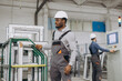 © anatoliycherkas - Factory worker moving aluminum window frames on production line