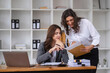 © wichayada - Professional Business Women Collaborating and Consulting with Colleagues in a Modern Office Environment