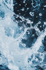 Poster - A splash of water with many small droplets. The water is blue and the droplets are clear