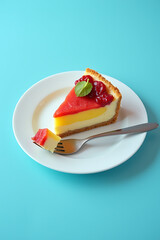Poster - A colorful slice of food from a bakery is placed on a blue background with a fork for eating and representing healthy choices._00003_